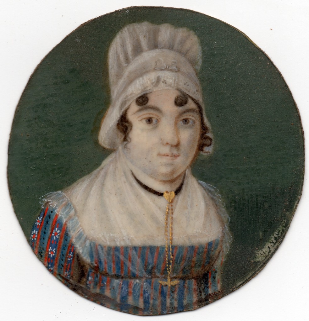 Portrait de jeune femme en coiffe et portant un pendantif en forme de Saint-Esprit.